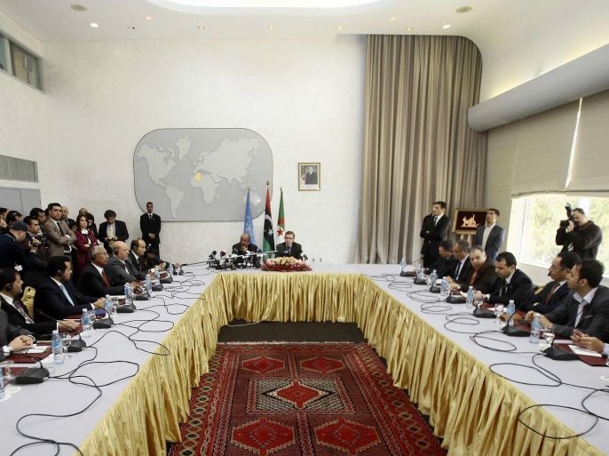 Special Representative of the Secretary-General for Libya and Head of United Nations Support Mission in Libya (UNSMIL), Bernardino Leon (back R), speaks as Algeria's Minister of African and Maghreb Affairs, Abdelkader Messahel (back L), listens as they head talks with Libyan political leaders and rivals in Algiers, March 10, 2015. Western leaders are backing the U.N. talks as the only way to end the turmoil in Libya, where two rival governments and armed factions are battling for control and Islamist militants have gained ground in the chaos. REUTERS/Ramzi Boudina (ALGERIA - Tags: POLITICS CIVIL UNREST)