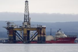 The J. W. McLean oil drill rig, operated by Transocean Ltd., stands anchored in the Cromarty Firth as the offshore pipelay vessel Deep Energy, operated by Technip SA, sits moored to the dockside in Invergorgon, U.K., on Wednesday, Aug. 6, 2014. Oil and gas extraction from the North Sea, a pillar of the Scottish economy, is a bone of contention in the debate on independence for Scotland that will culminate in a referendum on Sept. 18.