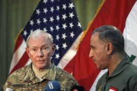U.S. Army General Martin Dempsey (L) speaks during a news conference with Iraq's Defence Minister Khaled al-Obeidi in Baghdad March 9, 2015. Dempsey, the top U.S. military officer, said on Monday that Islamic State would be defeated, as he visited Baghdad during an offensive against the radical insurgents which has seen Washington's military role overshadowed by Iran. REUTERS/Ahmed Saad (IRAQ - Tags: POLITICS MILITARY CONFLICT CIVIL UNREST)