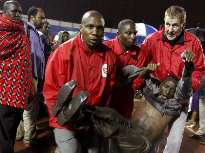 A rescued Garissa University student is carried by paramedics for treatment after arriving at Nyayo stadium to meet her relatives in Kenya's capital Nairobi April 4, 2015, after Thursday's attack by gunmen in their campus in Garissa. Kenya's President Uhuru Kenyatta said on Saturday that those behind an attack in which al Shabaab Islamist militants killed 148 people at a university were "deeply embedded" in Kenya, and called on Kenyan Muslims to help prevent radicalisation. The stadium is now a crisis centre manned by the Red Cross, for families to find out whether their relatives are alive or dead. REUTERS/Thomas Mukoya