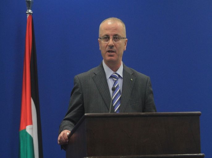 RAMALLAH, WEST BANK - NOVEMBER 8: Palestinian Prime Minister Rami Hamdallah speaks during a press conference after a meeting with EU High Representative for Foreign Affairs and Security Policy and Vice President of the European Commission Federica Mogherini (not seen) in Ramallah, West Bank on November 8, 2014.