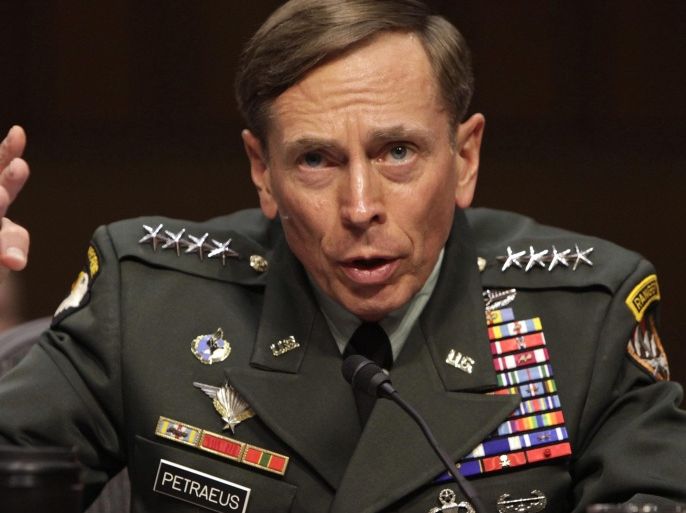 U.S. General David Petraeus gestures during the Senate Intelligence Committee hearing on his nomination to be director of the Central Intelligence Agency in Washington, in this file photo taken June 23, 2011. Petraeus has pleaded guilty in federal court to a charge of unauthorized removal and retention of classified information, the U.S. Justice Department said on Tuesday. REUTERS/Yuri Gripas/Files (UNITED STATES - Tags: POLITICS MILITARY CRIME LAW)