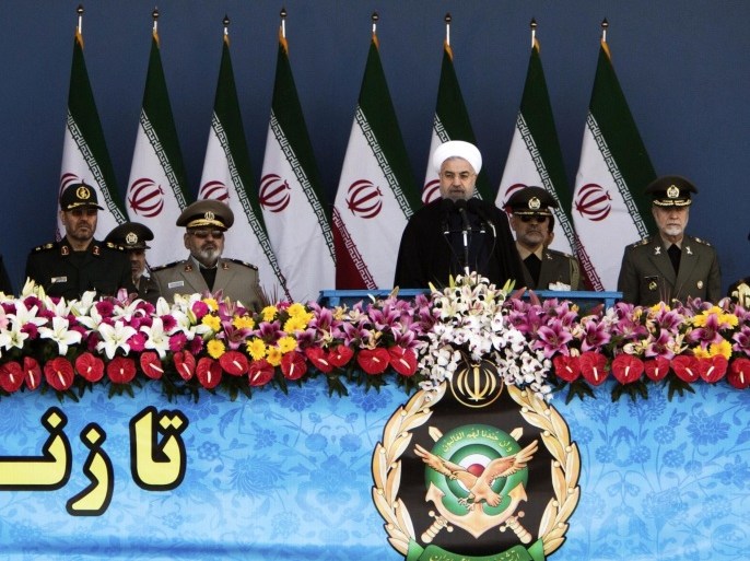 Iranian military commanders listen to President Hassan Rouhani (C) as he dlivers a speech during the Army Day parade in Tehran on April 18, 2015. Amid rising tension between Iran and Saudi Arabia, Rouhani said that Iran's military is purely for defence and should not be seen as an aggressive threat in the Middle East. AFP PHOTO/BEHROUZ MEHRI