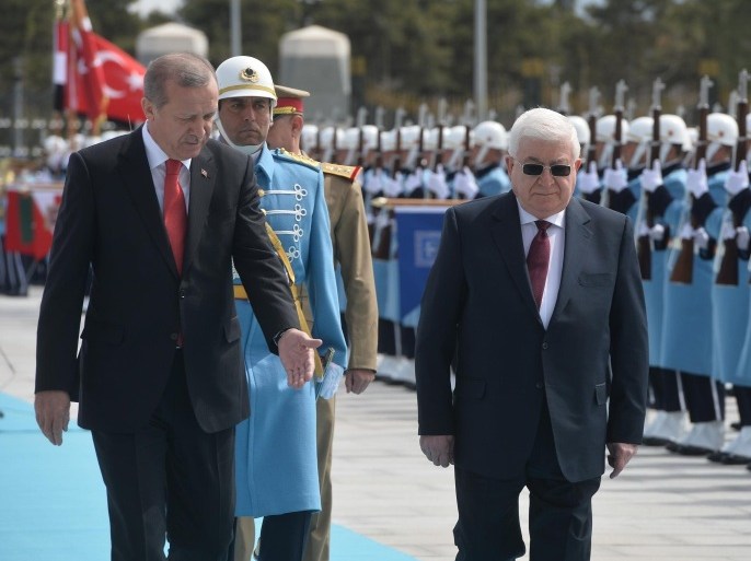 ANKARA, TURKEY - APRIL 22: President of Turkey Recep Tayyip Erdogan (front L) and Iraqi President Fuad Masum (front R) review the honor guard during an official welcoming ceremony at the presidential palace in Ankara, Turkey on April 22, 2015.