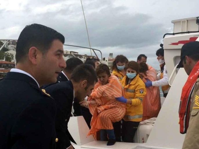 MUGLA, TURKEY - APRIL 6: Rescuers evacuate the survivors after a boat carrying illegal immigrants sank offshore Datca, Mugla, Turkey on April 6, 2015. At least four people have drowned and nine people were rescued after a boat illegally carrying migrants to the Greek islands sank in the Aegean Sea, officials said.