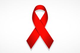 الشريط الأحمر هو شعار عالمي للتوعية بالإيدز ودعم الأشخاص المصابين به, the red ribbon is the universal symbol of awareness and support for those living with HIV.