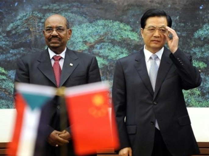 Chinese President Hu Jintao, right, and Sudan's President Omar al-Bashir attend the signing ceremony at the Great Hall of the People in Beijing Wednesday, June 29, 2011. China rolled out the red carpet Wednesday for a state visit by Sudan's president, who is wanted on an international warrant that accuses him of war crimes.