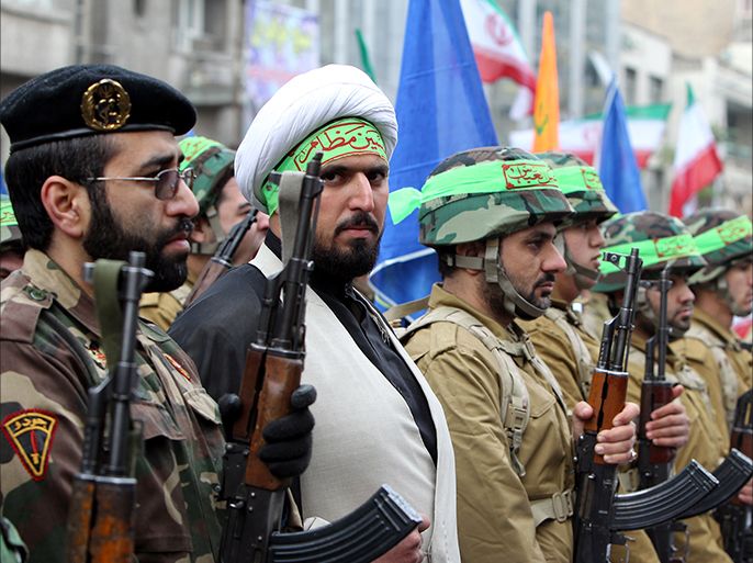 epa03014712 Members of Iranian paramilitary Basij (volunteer) forces hold a parade in front the former US embassy in Tehran, Iran, 25 November 2011. Commander of Iran's Basij (volunteer) force Brigadier General Mohammad Reza Naqdi said that the volunteer forces are ready to respond any treats by Israel. He added that Basij fully prepared to defend Iran against enemies' treats. EPA/ABEDIN TAHERKENAREH