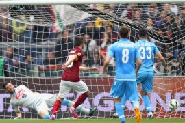 ROME, ITALY - APRIL 04: Miralem Pjanic of AS Roma scores the opening goal during the Serie A match between AS Roma and SSC Napoli at Stadio Olimpico on April 4, 2015 in Rome, Italy.