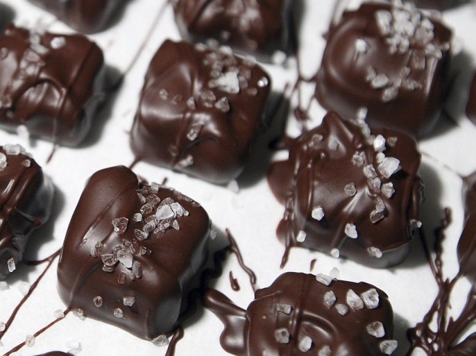 In this Dec. 11, 2014 photo, Dark Sea Salt Caramel Chocolates, currently among the most popular treats made at the R.G.W. Candy Company, are seen displayed at the company near Atlanta, Ill. (AP Photo/Herald & Review, Jim Bowling)