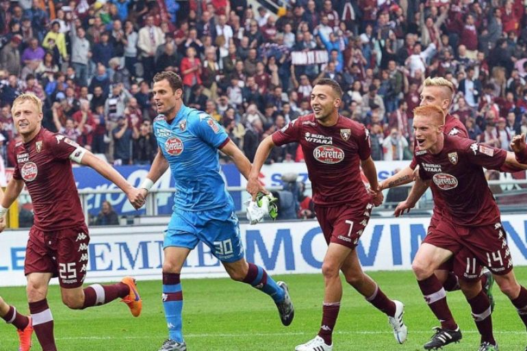 Torino players celebrate after the Italian Serie A soccer match between Torino FC and Juventus FC at Olimpico stadium in Turin, Italy, 26 April 2015. Torino won 2-1.