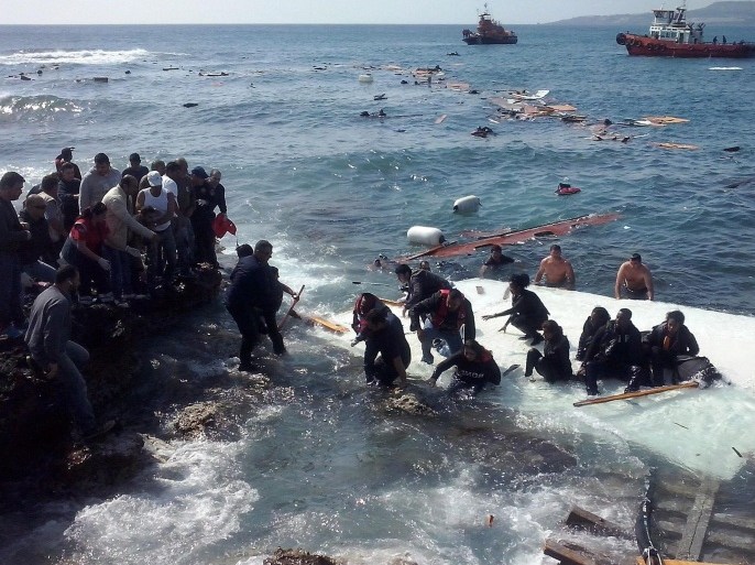 Illegal migrants arrving at Zefyros beach at Rhodes island, in Greece 20 April 2015. A ship with 200 undocumented migrants on board run aground at Rhodes central beach Zefyros. Most of the migrants fell into the water and managed to swim safely to the beach with the assistance of the locals. The ship run aground on rocks and according to initial estimations the vessel has severe damages. The bodies of a man, a woman and a child were recovered during a rescue operation.