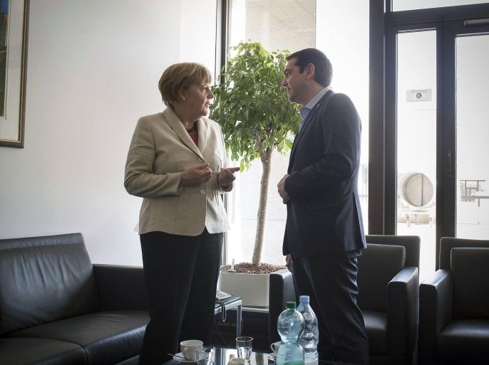 Germany's Chancellor Angela Merkel and Greece's Prime Minister Alexis Tsipras speak at the start of their meeting at the European Union leaders summit in Brussels, in this April 23, 2015 handout photo by Bundesregierung. REUTERS/Bundesregierung/Guido Bergmann/Handout via Reuters ATTENTION EDITORS - EDITORIAL USE ONLY. NOT FOR SALE FOR MARKETING OR ADVERTISING CAMPAIGNS. NO SALES. NO ARCHIVES. THIS PICTURE WAS PROVIDED BY A THIRD PARTY. IT IS DISTRIBUTED EXACTLY AS RECEIVED BY REUTERS, AS A SERVICE TO CLIENTS.