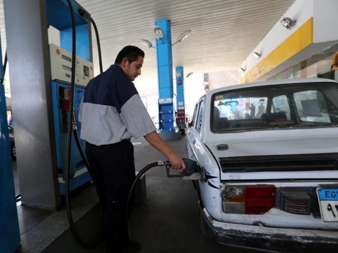 An Egyptian worker at a gas station fills a car at a fuel station in Cairo, Egypt, 05 July 2014. The Egyptian government raised fuel prices on 05 July to rein in the runaway budget deficit, a non-populist move that would test the popularity of new President Abdel-Fattah al-Sissi. The increases, covering the prices of petrol, diesel and natural gas used for cars, hover between 40 per cent and 77 per cent, according to local media.