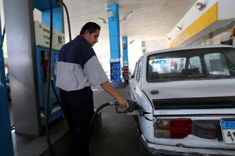An Egyptian worker at a gas station fills a car at a fuel station in Cairo, Egypt, 05 July 2014. The Egyptian government raised fuel prices on 05 July to rein in the runaway budget deficit, a non-populist move that would test the popularity of new President Abdel-Fattah al-Sissi. The increases, covering the prices of petrol, diesel and natural gas used for cars, hover between 40 per cent and 77 per cent, according to local media.