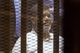 CAIRO, EGYPT - APRIL 21: Egypt's former president Mohammed Morsi looks from behind dock bars during trial session, in Cairo, Egypt on 21 April 2015. An Egyptian court sentenced Mohammed Morsi to 20 years in prison over the killing of protesters during a 2012 demonstration outside the presidential palace in Cairo.