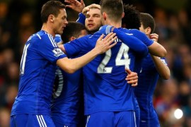 LONDON, ENGLAND - APRIL 04: Eden Hazard of Chelsea celebrates with team-mates after scoring the opening goal from the penalty spot during the Barclays Premier League match between Chelsea and Stoke City at Stamford Bridge on April 4, 2015 in London, England.