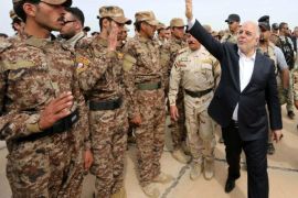 A handout picture released by the Iraqi prime minister's office shows Iraqi Prime Minister Haider al-Abadi (R) greeting Sunni volunteers at Habbaniyah base in eastern Ramadi city, west of Iraq, 08 April 2015. Al-Abadi arrived in Ramadi city and met with local officials and announced that the next battle will be in Anbar province. Media reports state that the prime minister visited the Habbaniyah base to see the preparations for the Liberation of the province from the control of Islamic state militia (IS) and distributed weapons to Sunni volunteers who will participate in the liberation of Anbar province from the control of Islamic state fighters. EPA/IRAQI PRIME MINISTER OFFICE / HANDOUT