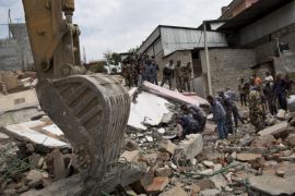 Nepalese security personnel engage themselves in a rescue operation at the site of a budget hotel that collapsed in Saturday’s earthquake, in Kalanki neighbourhood of Kathmandu, Nepal, Sunday, April 26, 2015. A powerful aftershock shook Nepal on Sunday, making buildings sway and sending panicked Kathmandu residents running into the streets a day after a massive earthquake devastated the region and destroyed homes and infrastructure. (AP Photo/Bernat Armangue)