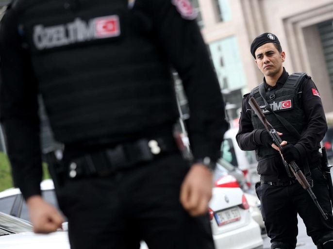 Members of special security forces stand outside the main courthouse in Istanbul, Turkey, Tuesday, March 31, 2015. Turkish news agencies say that members of a banned leftist group have taken a chief prosecutor hostage in his office inside the courthouse. State-run Anadolu Agency and state television, TRT, identified the prosecutor as Mehmet Selim Kiraz. He is the prosecutor investigating the death of a teenager who was hit by a police gas canister fired during nationwide anti-government protests in 2013.(AP Photo/Emrah Gurel)