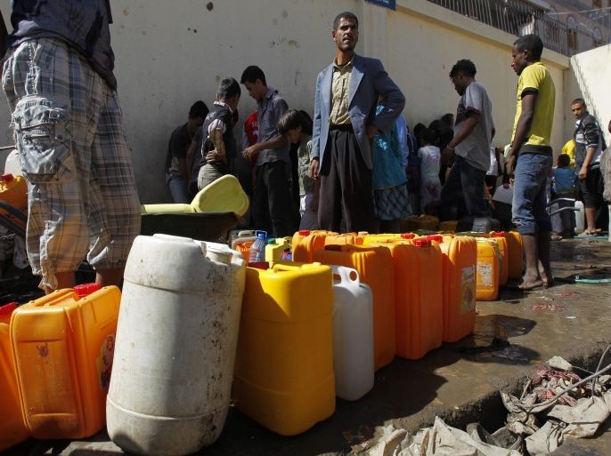 Yemenis wait to fill jerry cans with water from a philanthropist-provided water tap in Sana'a, Yemen, 16 April 2015. According to reports, many Yemenis were affected by the airstrikes carried out by the Saudi-led coalition against Houthi rebels, as they are facing shortage of water and food. Aid agencies warn of a looming humanitarian crisis as essential goods begin to run low in the impoverished country. Saudi Arabia and eight fellow Sunni Arab countries in late March launched an air campaign against Shiite Houthi rebels in Yemen, vowing not to stop until Yemen's internationally recognized President Abd Rabu Mansour Hadi, a Sunni, is reinstated.