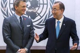 Actor Daniel Craig (L) laughs with UN Secretary General Ban Ki-moon at a service designating Craig as the UN Global Advocate for the Elimination of Mines and Explosive Hazards at the United Nations Headquarters in New York April 14, 2015. REUTERS/Lucas Jackson