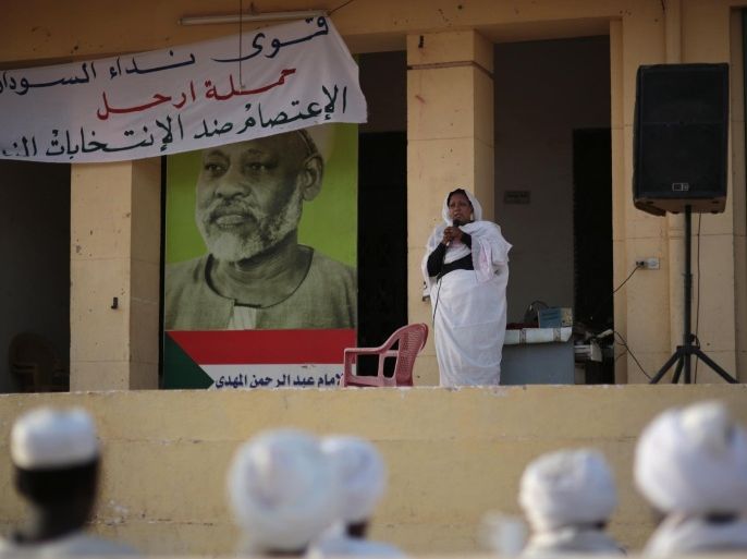 Members of Sudanese opposition parties take part during a sit-in at the headquarters of Umma, one of Sudan’s biggest opposition parties, calling for boycotting the elections, on the eve of the presidential elections where longtime autocratic President Omar al-Bashir is expected to secure easy victory, in Khartoum, Sudan, Sunday, April 12, 2015. (AP Photo/Mosa'ab Elshamy)