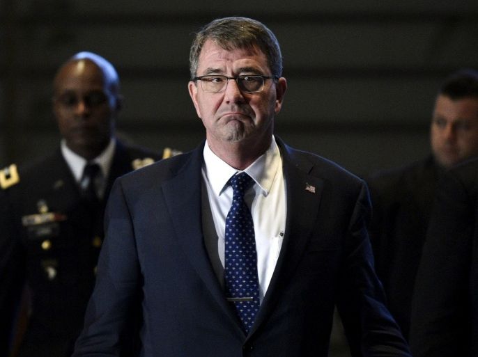 U.S. Secretary of Defense Ashton Carter walks on his way to meet Japan's Prime Minister Shinzo Abe at Abe's official residence in Tokyo, Japan, 08 April 2015. Carter kicked off his first Asian tour on Wednesday with a stern warning against the militarisation of territorial rows in a region where China is at odds with several nations in the East and South China Seas. REUTERS/Franck Robichon/Pool
