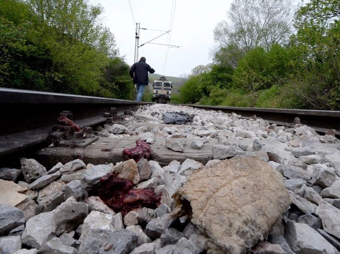 Piece of bread and human remains seen on the tracks, at the place where fourteen illegal immigrants were killed in a train accident on the railroad tracks between the capital Skopje and Veles, the Former Yugoslav Republic of Macedonia early 24 April 2015. Many illegal imigrants have lost their lives in the last year on the railroad tracks between border town Gevgelija and Kumanovo on their way to Europen Union. The country has a poor reputation as a host country for asylum seekers, who rarely choose to stay and prefer to head to wealthier northern and western European countries. Migrants travel along railtracks at night to evade the police. EPA/GEORGI LICOVSKI ATTENTION EDITORS