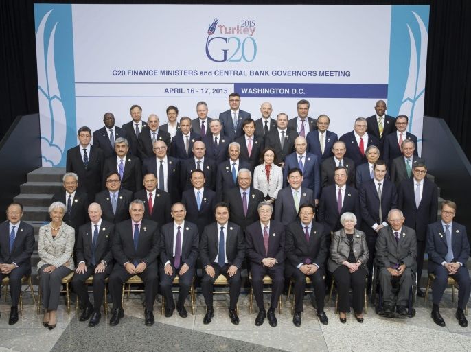 A handout photo provided by the International Monetary Fund (IMF) shows IMF Managing Director Christine Lagarde (2-L front row) posing with the G-20 Finance Ministers and Bank Governors for the Group photo following their meeting at the IMF Headquarters in Washington DC, USA, 17 April 2015. EPA/Steve Jaffe / HANDOUT