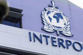 Security cameras pictured against the Interpol logo on the Interpol Global Complex for Innovation building (IGCI) in Singapore, 14 April 2015. Interpol's first digital crime centre was officially opened in Singapore on 13 April 2015. Complementing its headquarters in Lyon, the Interpol Global Complex for Innovation (ICGI) will support international policing efforts against cybercrime, as well as research and capacity building in online security.