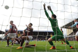 BURNLEY, ENGLAND - APRIL 11: Aaron Ramsey scores a goal for Arsenal past Tom Heaton of Burnley during the match between Burnley and Arsenal in the Barclays Premier League at Turf Moor on April 11, 2015 in Burnley, England.