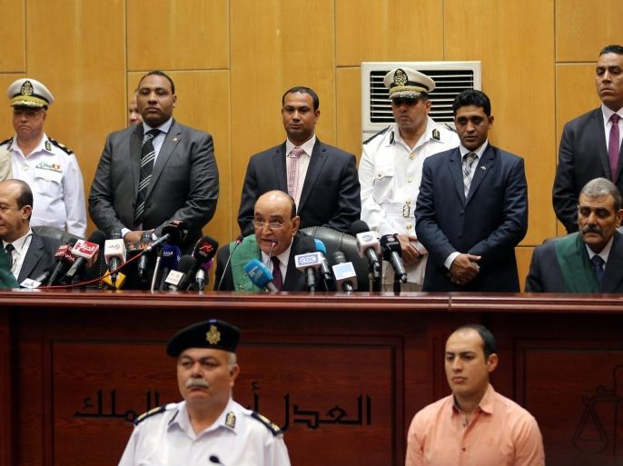 Egyptian judge Ahmed Sabry Yousef (C, on bench) presides over the trial session of ousted president Mohammed Morsi, in Cairo, Egypt, 21 April 2015. An Egyptian court sentenced ousted president Mohammed Morsi and 12 other Muslim Brotherhood leaders and officials to 20 years in prison over the killing of protesters during a 2012 demonstration outside the presidential palace in Cairo.