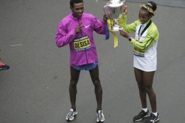Men's winner Lelisa Desisa of Ethopia (L) and Women's winner Caroline Rotich of Kenya (R) celebrate at the 119th Boston Marathon in Boston, Massachusetts, USA 20 April 2015. It was on 15 April 2013 when two bombs exploded near the finish line killing three and injuring over 260 spectators.