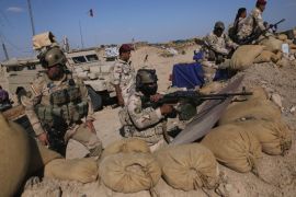 AL-KARMAH, IRAQ - APRIL 14: Iraqi Army troops take positions on the frontline with ISIL on April 14, 2015 near Al-Karmah, in Anbar Province, Iraq. Iraqi government forces are assaulting ISIL fighters on frontline positions which were established last year when ISIL captured much of the province.