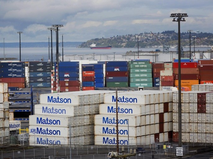 Shipping containers sit stacked at the Port of Seattle in Seattle, Washington, U.S., on Tuesday, March 30, 2015. The U.S. Census Bureau is scheduled to release international trade balance figures on April 2.