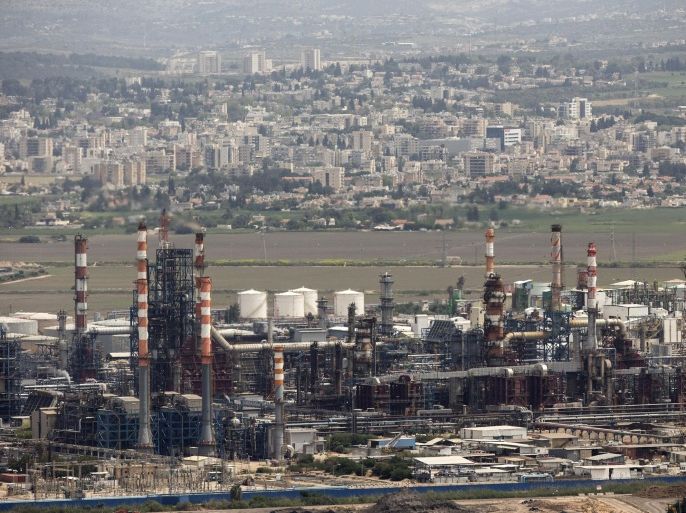 A general view shows an oil refinery, in Israel's third city of Haifa on April 20, 2015, after the city's Mayor Yona Yahav ordered municipal rubbish trucks to block access to four chemical plants and a refinery after warnings linking high cancer rates in the area to air pollution. The standoff began after a senior health ministry official said last week that 16 percent of cancer cases in the Haifa Bay area could be attributed to air pollution. AFP PHOTO / JACK GUEZ