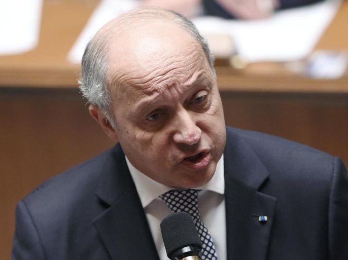 French Foreign Affairs minister Laurent Fabius addresses a Member of Parliament during a session of Questions to the Government, on April 7, 2015 at the French National Assembly in Paris. AFP PHOTO / LOIC VENANCE