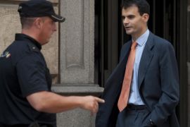 Spanish High Court judge Pablo Ruz (R) leaves the court in Madrid on July 16, 2013. Pablo Ruz, the judge in charge of an alleged slush fund scandal probe and a separate corruption case, both implicating former PP (Popular Party)'s treasurer Luis Barcenas, quizzed Barcenas on July 15. Barcenas told the judge that he had handed 25,000 euros (33,000 USD) in cash to Rajoy in 2010 and the same amount to the party's deputy leader Maria Dolores de Cospedal, sources present at the hearing told reporters afterwards.