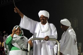 (FILE) A file photo dated 09 April 2015 shows incumbent Sudanese President, Omar al-Bashir, (C) waving to supporters during a campaign rally for the presidential elections in Khartoum, Sudan. Sudan's elections commissions announced on 27 April that President al-Bashir was re-elected after securing 94 percent of the votes.