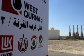 The company logo of Lukoil is seen in West Qurna oilfield in Iraq's southern province of Basra, March 29, 2014. Production from Iraq's giant West Qurna-2 oilfield will lift national output to 4 million barrels per day (bpd) by the end of the year, oil minister Abdul Kareem Luaibi said on Saturday. Russia's Lukoil began commercial production from the field on Saturday with initial output of 120,000 bpd, which is expected to rise to 400,000 bpd by the end of the year, and eventually reach 1.2 million. REUTERS/Essam Al-Sudani (IRAQ - Tags: BUSINESS LOGO POLITICS ENERGY)