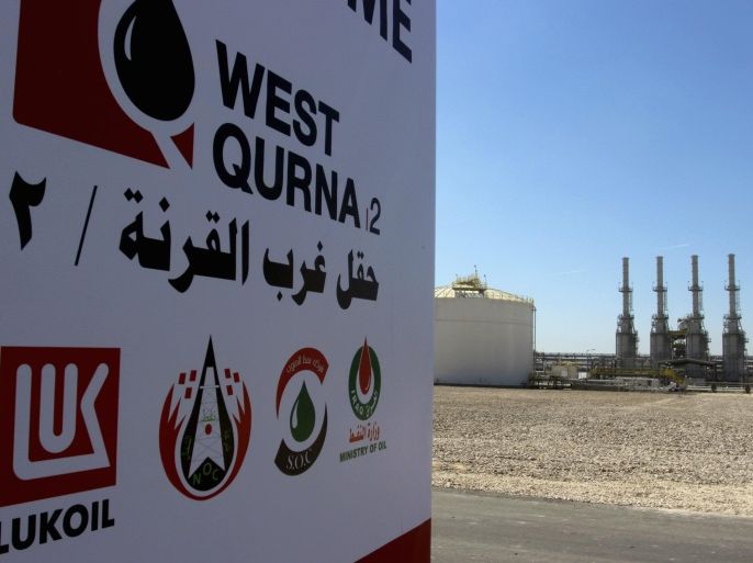 The company logo of Lukoil is seen in West Qurna oilfield in Iraq's southern province of Basra, March 29, 2014. Production from Iraq's giant West Qurna-2 oilfield will lift national output to 4 million barrels per day (bpd) by the end of the year, oil minister Abdul Kareem Luaibi said on Saturday. Russia's Lukoil began commercial production from the field on Saturday with initial output of 120,000 bpd, which is expected to rise to 400,000 bpd by the end of the year, and eventually reach 1.2 million. REUTERS/Essam Al-Sudani (IRAQ - Tags: BUSINESS LOGO POLITICS ENERGY)