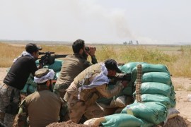 KIRKUK, IRAQ - APRIL 18: Iraqi Kurdish Peshmerga forces and al-Hashd al-Shaabi factions conduct a military operation against Daesh militants in Bashir village, southwest of Kirkuk city, Iraq on April 18, 2015.