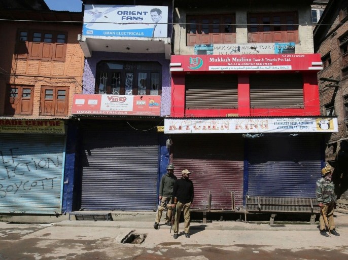 Indian policemen stand guard in front of a closed market during a shutdown in Srinagar, the summer capital of Indian Kashmir, 11 April 2015. The separatists had called for a shutdown to protest the government's decision of settling displaced Kashmiri Pandits in satellite townships. Indian Kashmir Chief Minister, Mufti Muhammad Sayeed has already said the government does not plan to settle the displaced Kashmir Pandits in any satellite townships but wants them to return to their respective homes in Kashmir valley.