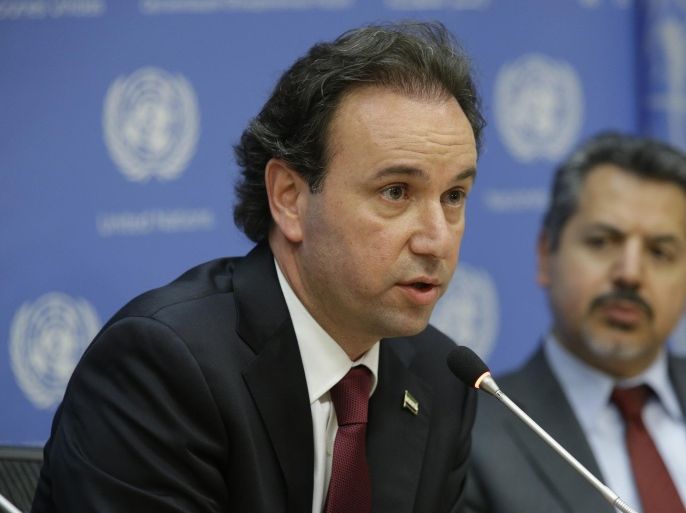 Khaled Khoja, President of the Coalition of Syria Revolution and Opposition Forces, speaks to reporters during a news conference Wednesday, April 29, 2015, at United Nations headquarters. At right is Najib Ghadbian, Special Representative to the United States and United Nations. (AP Photo/Mary Altaffer)