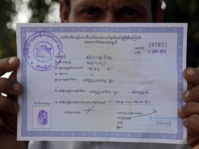 A Bengali man, so called Rohingya, shows a document of his family members after he returned the 'white card', a temporary registration document, to official at the ThetKelPyin Muslim refugee camp in Sittwe, Rakhine State, western Myanmar, 03 April 2015. White cards, documents granting temporary registration in Myanamar, expired on 31 March 2015 and about 1.5 million holders had to return their cards to government officials, Myanmar President's office announced.
