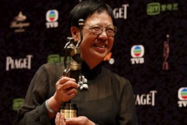 Hong Kong director Ann Hui poses with her trophy after winning the Best Director award for her movie "The Golden Era" at the Hong Kong Film Awards in Hong Kong April 19, 2015. REUTERS/Bobby Yip