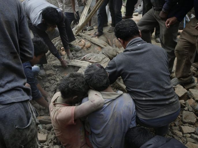 People try to dig out bodies from under the rubble of a destroyed building after an earthquake hit Nepal, in Kathmandu, Nepal, 25 April 2015. A 7.9-magnitude earthquake rocked Nepal destroying buildings in Kathmandu and surrounding areas, with unconfirmed rumours of casualties. The epicentre was 80 kilometres north-west of Kathmandu, United States Geological Survey. Strong tremors were also felt in large areas of northern and eastern India and Bangladesh. EPA/NARENDRA SHRESTHA ATTENTION EDITORS: GRAPHIC CONTENT.