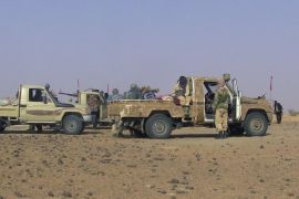 Fighters from the Tuareg separatist rebel group MNLA drive in the desert near Tabankort, February 15, 2015. Mali's government and Tuareg-led rebels resumed U.N.-sponsored peace talks in Algeria on Monday in pursuit of an accord to end uprisings by separatists seeking more self-rule for the northern region they call Azawad. Picture taken February 15, 2015. REUTERS/Souleymane Ag Anara (MALI - Tags: MILITARY CONFLICT POLITICS)