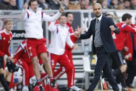 Bayern's head coach Pep Guardiola reacts after his side scored the second goal during a German first division Bundesliga soccer match between TSG 1899 Hoffenheim and Bayern Munich in Sinsheim, Germany, Saturday, April 18, 2015. (AP Photo/Michael Probst)